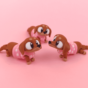 Porte-clé teckel articulé imprimé en 3D, chien marron au manteau rose à pois